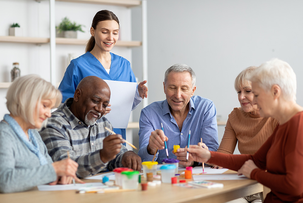 Senior Citizens in Assisted Living Facility Receiving Memory Care Exercises